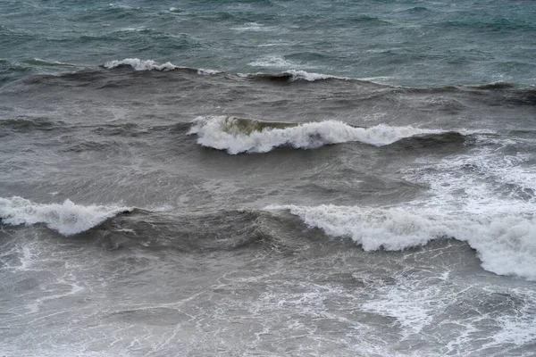 Waves in a rough sea off the coast of Liguria, Italy