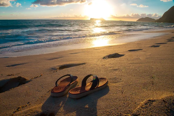 Beach Sandals and Hawaii pacific ocean taken in Oahu island, America. Oahu is known a tropical island located in Hawaii, United States.