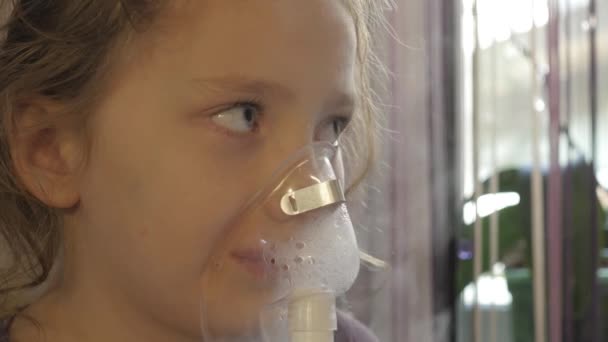 A little sick girl is inhaled from a viral infection. 4k — Stock Video