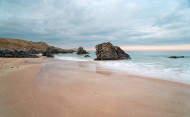 Stormy sunset at Sango Bay beach at Durness in the far north of Scotland clipart