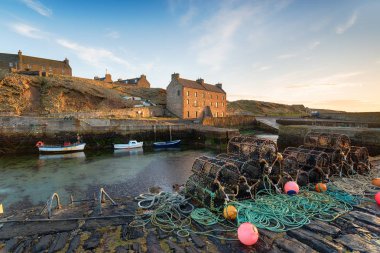Lobster pots in the harbour at Keiss near Wick in Caithness on the north east coast of Scotland clipart