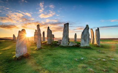 Stunning sunset over the Callanish stone circle on the Isle of Lwais in the Outer Hebrides of Scotland clipart