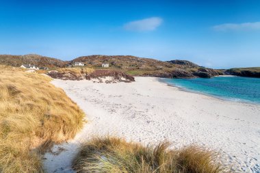 Blue skies and white sands at Clachtoll Beach in the highlands of Scotland clipart