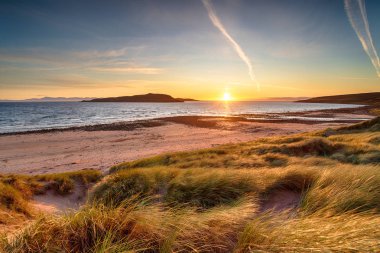Sunset over the dunes at Big Sand Beah at Gairloch clipart