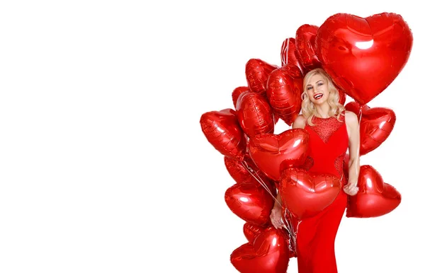 Hermosa Mujer Rubia Sonriente Posando Sosteniendo Globos Rojos Del Corazón Imágenes De Stock Sin Royalties Gratis