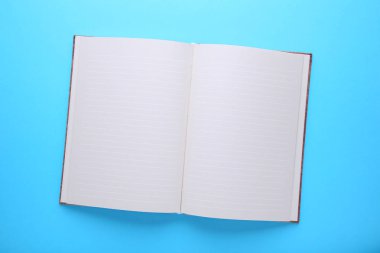Defter üzerinde mavi arka plan, düz yatıyordu, en iyi görünümü