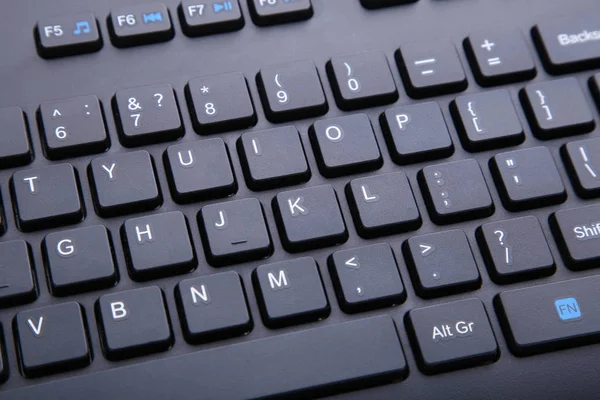 Black computer keyboard. English keyboard closeup. Business or education concept