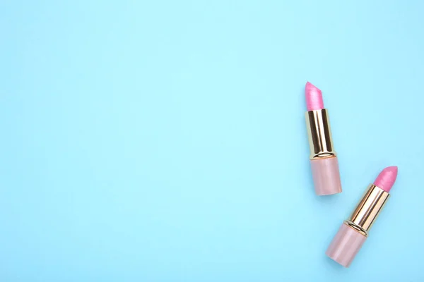 Two Pink Lipstick Blue Background Cosmetic — Stock Photo, Image