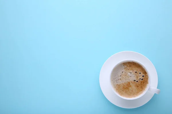 Cup of coffee on blue background. Cup of coffee