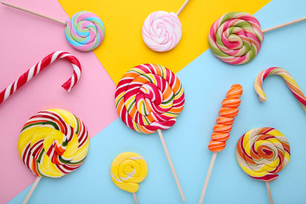 Many lollipops on colorful background. Studio shot