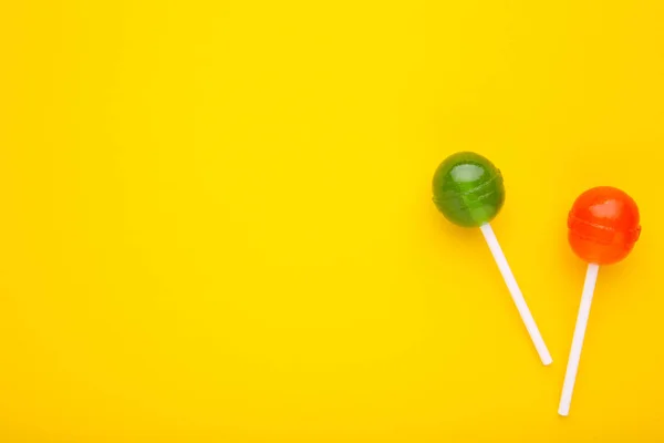 Colorful Lollipops Yellow Background Sweet Candy Concept — Stock Photo, Image