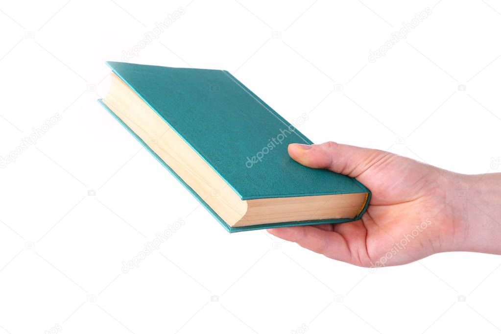 Man hand holding green old book on white background