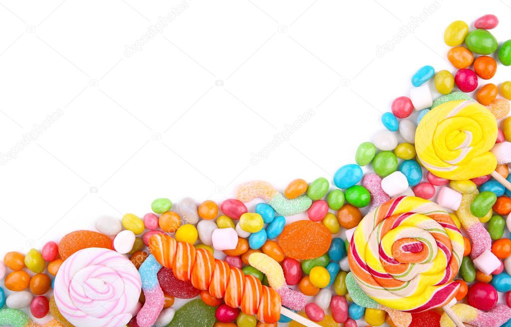 Colorful lollipops and different colored round candy isolated