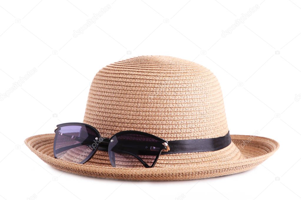 Vintage fabricate straw hat and sunglasses isolated on white background.