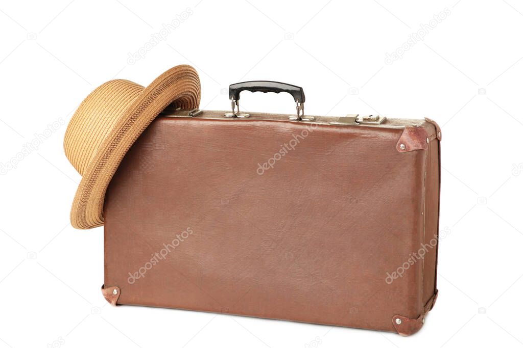 Leather old suitcase with hat isolated on white background. Top view