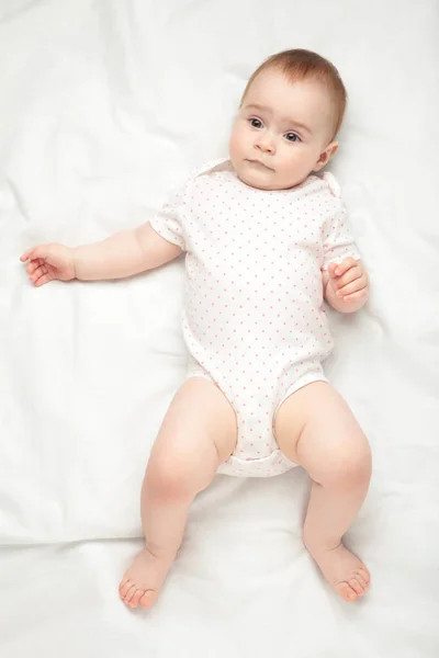 Cute Baby Girl Lying White Bed Top View — Stock Photo, Image