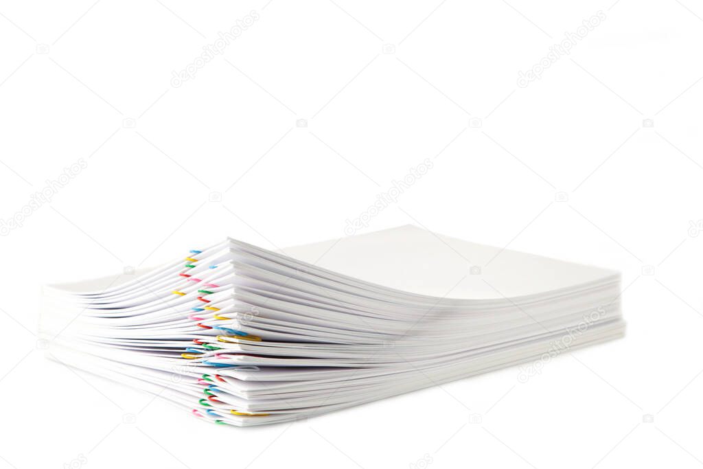 Colorful paper clip with pile of overload white paperwork isolated on white. Top view