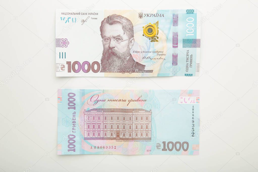 1000 new banknote of Ukraine on white background. Save and money cocncept. Ukrainian Money. Top view