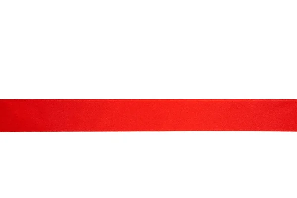 Shiny red ribbon isolated on white background. Top view