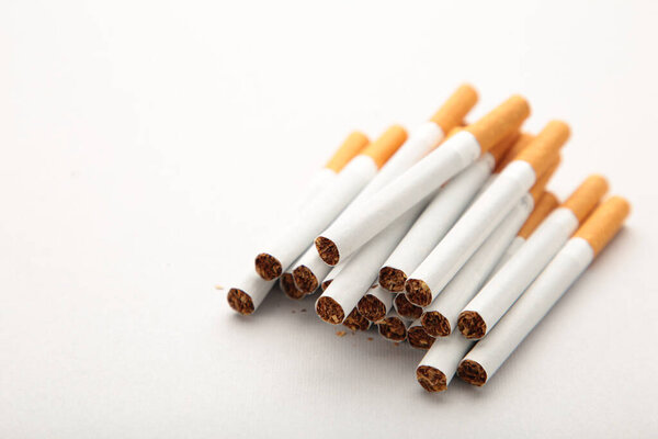Cigarettes on grey background with copy space. Top view.