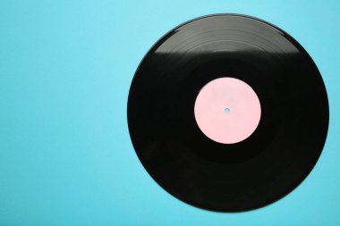 Mavi arka planda plak kaydı. Mesaj için yer var. Üst görünüm