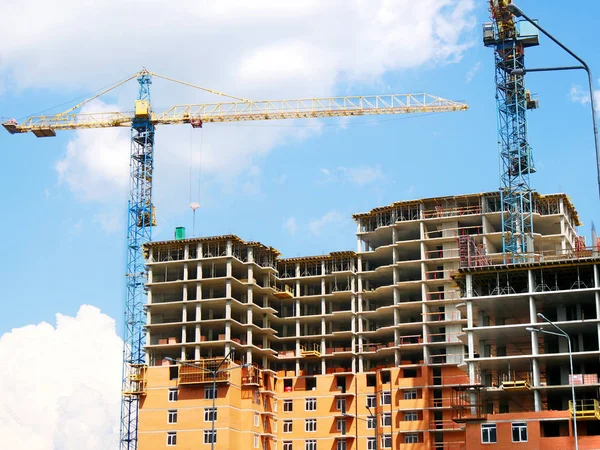 Construction site. Building site with two cranes. Concrete build