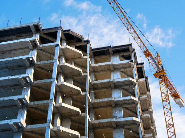 Construction of a multi-storey residential complex. Crane near t
