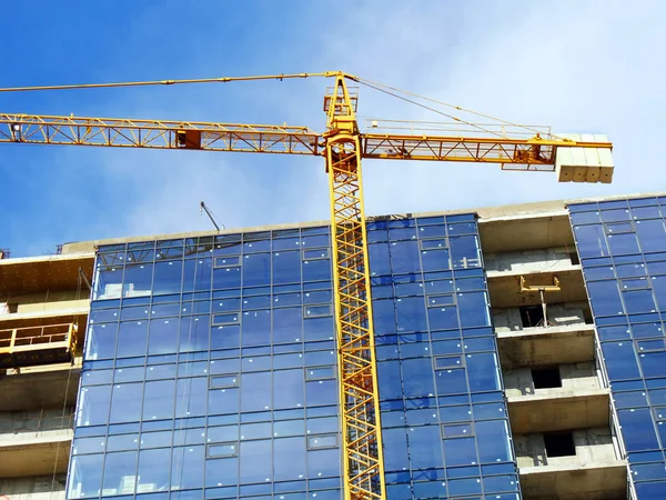Modern construction site background. Crane near building under c