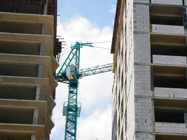 Construction site with crane and concrete buildings. Crane. Mult — Stock Photo, Image