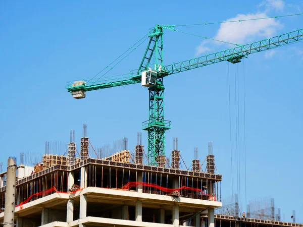 Construction site. Building site with crane. Concrete building u