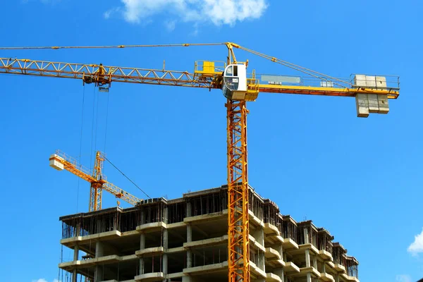 Two construction cranes near building. Construction site. Indust — Stock Photo, Image