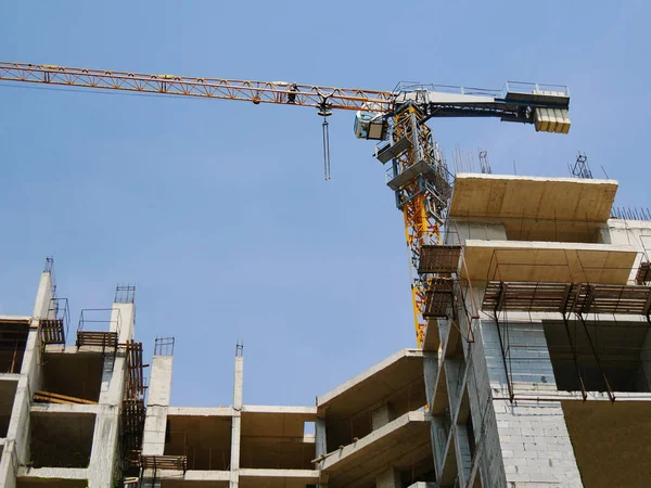 Construction site. Building site with crane. Concrete building u