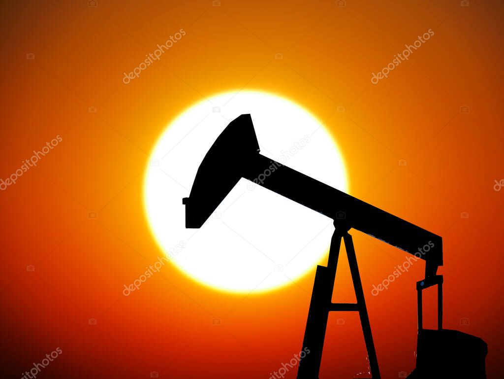 Oil rig on a sunset background. Oil rig on the background of dawn.