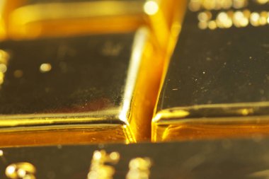 Close up shot of stacked 999.9 pure gold bar ingot on a white background, represented the business, invesment and finance concept idea