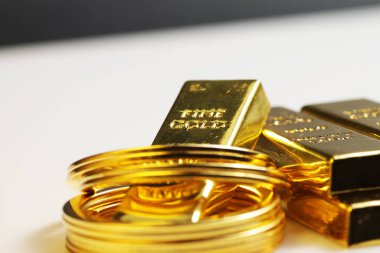 Close up shot of stacked 999.9 pure gold bar ingot on a white background, represented the business, invesment and finance concept idea