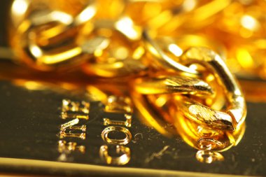 close up shot of stacked 999.9 pure gold bar ingot on a black background, represented the business, invesment and finance concept idea