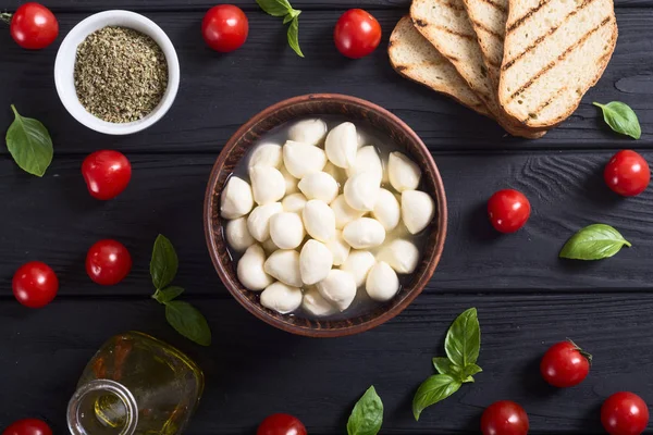 Mozzarella , cherry tomatoes and bread . Italy healthy food