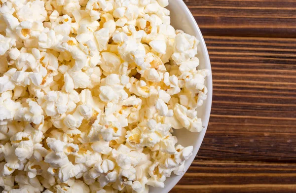 Popcorn snack in bowl . Pop corn ready to wath cinema