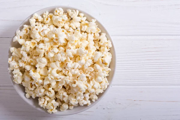 Popcorn snack in bowl . Pop corn ready to wath cinema