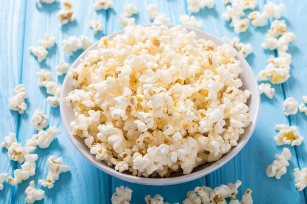 Popcorn snack in bowl . Pop corn ready to wath cinema