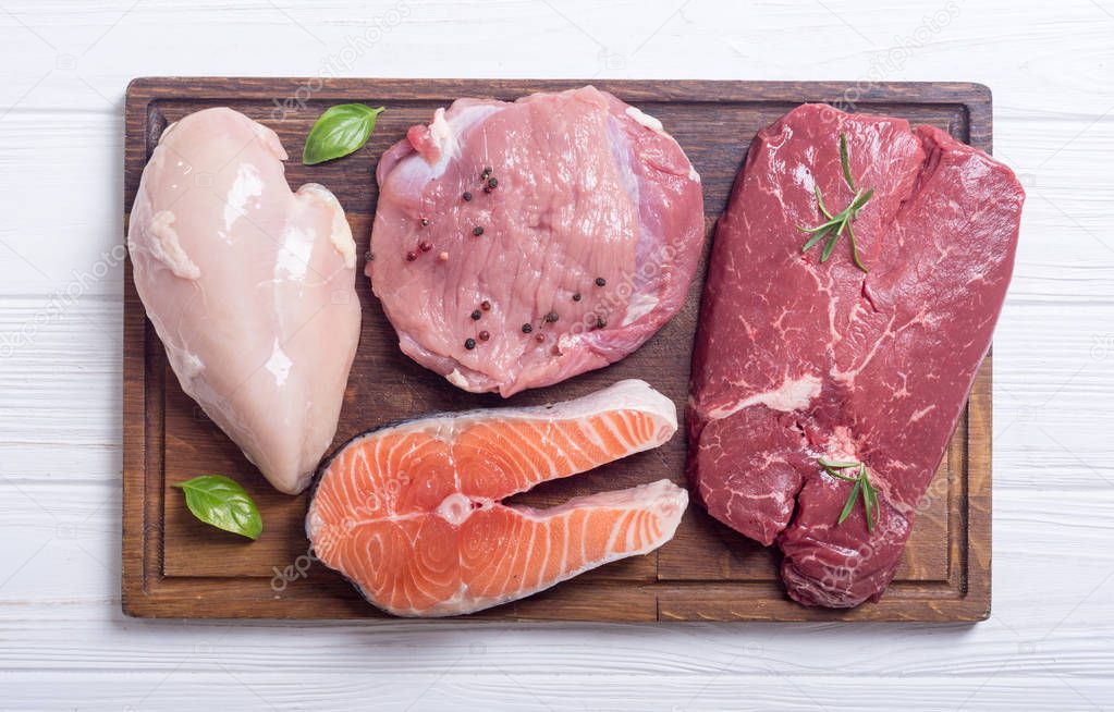 Mix of steak meat : salmon , beef , pork and chicken