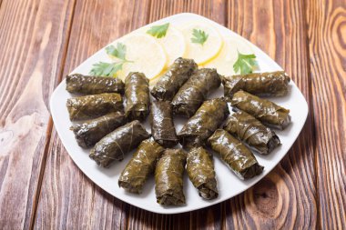 Dolma from grape of vines with rice  , meat and spices clipart