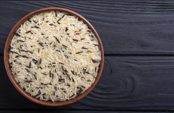 stock image Raw wild rice white and black . Food on rustic background