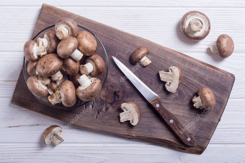 Fresh raw royal champignon . Mushrooms on rustic background