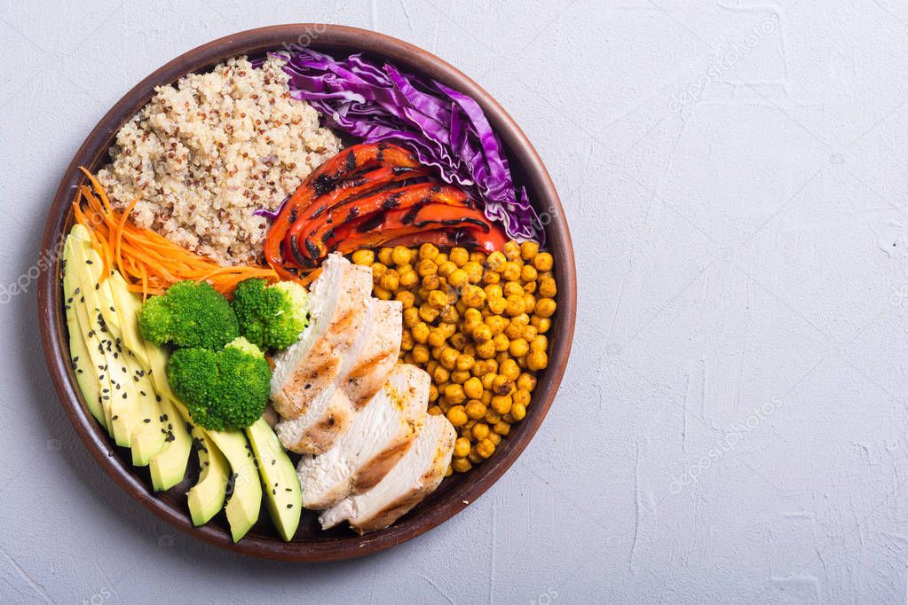 Buddha bowl with avocado , chicken , pepper , quinoa and chickpea . Healthy food