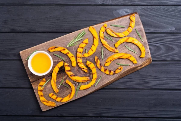 Grilled pumpkin with rosemary and honey . Healthy autumn food
