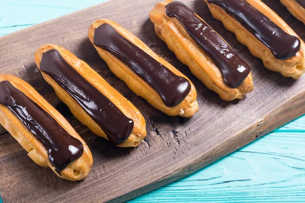 French dessert eclair with chocolate . Delicious food background