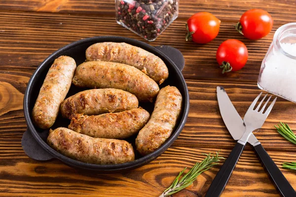 Grilled sausages with tomatoes , pepper and rosemary — Stock Photo, Image