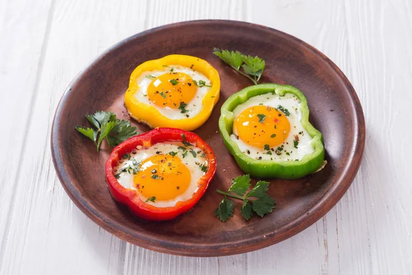 Yellow , red and green pepper with fried eggs — Stock Photo, Image