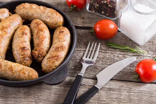 Grilled sausages with tomatoes , pepper and rosemary — Stock Photo, Image